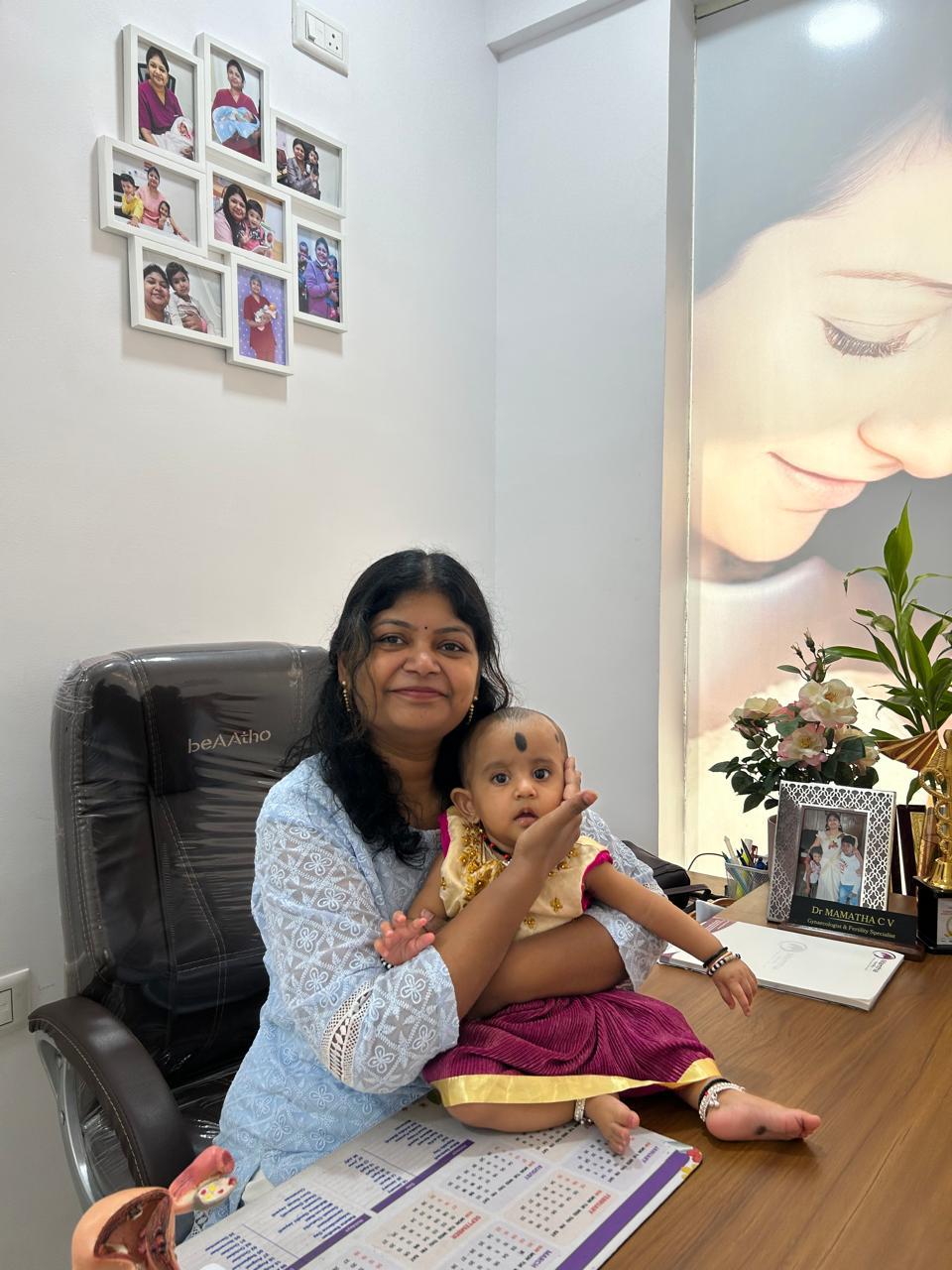 Dr. Mamtha C.V. with a baby at her clinic