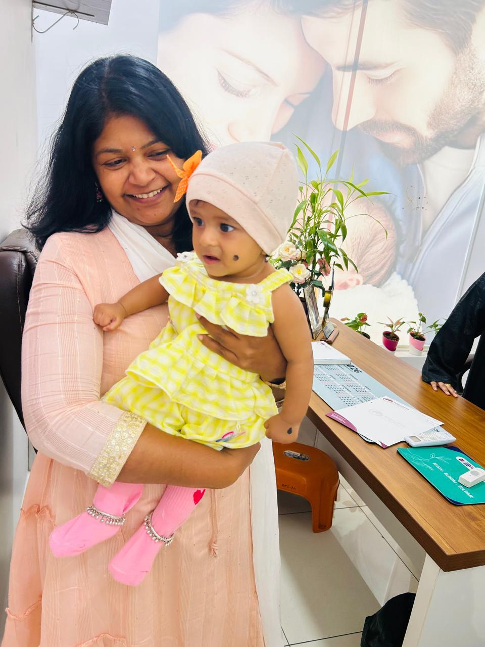 Dr. Mamtha C.V. holding a baby inside her IVF clinic