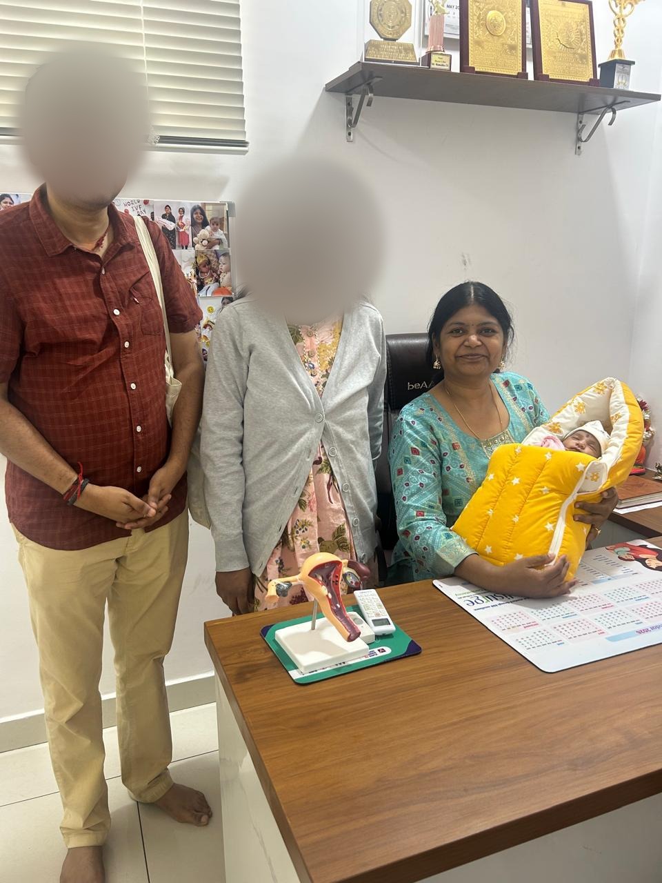 A family with Dr. Mamtha C.V. and their newborn baby