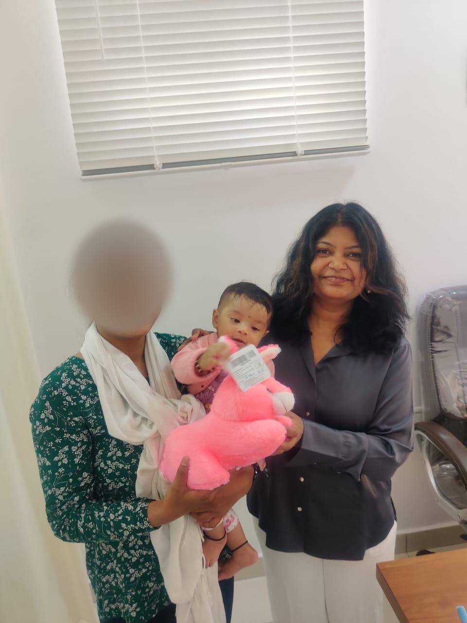 A mother and baby visiting Dr. Mamtha C.V.
