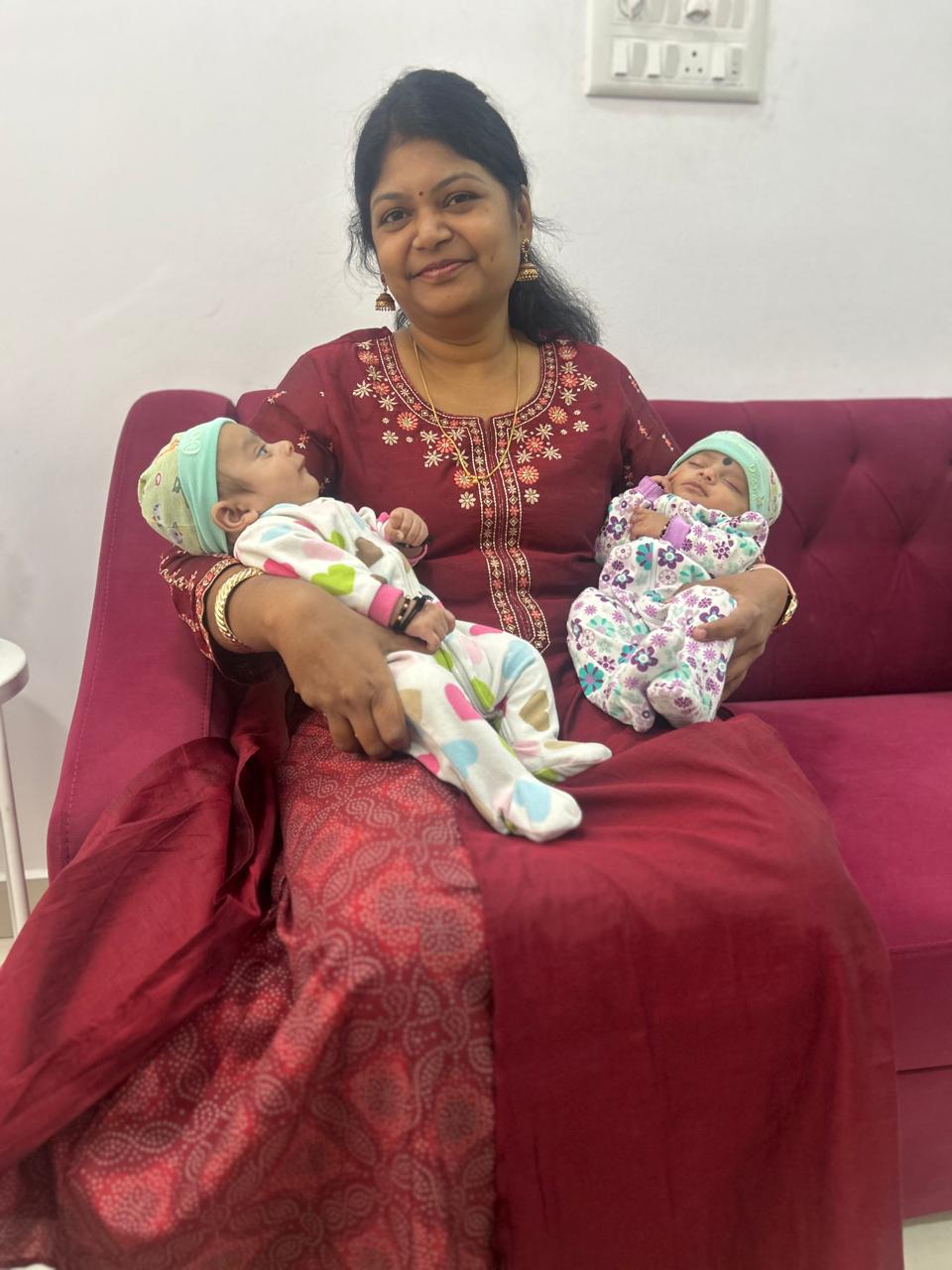 Dr. Mamtha C.V. holding two newborn babies